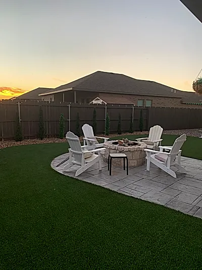 Painted fence and fire pit area by E and J General Construction